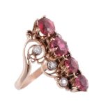 A spinel and diamond ring, circa 1900, set with a central row of circular...  A spinel and diamond