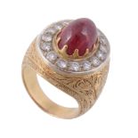 A cabochon ruby and diamond ring , the sugarloaf cabochon ruby within a...  A cabochon ruby and