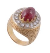 A cabochon ruby and diamond ring , the sugarloaf cabochon ruby within a...  A cabochon ruby and