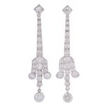 A pair of diamond drop earrings, the tapering articulated box links set with...  A pair of diamond