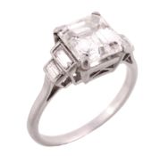 A diamond single stone ring, the square step cut diamond weighing 2  A diamond single stone