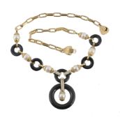 An onyx, cultured pearl and diamond necklace by Graff  An onyx, cultured pearl and diamond