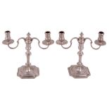A pair of cast silver twin branch candelabra, maker's mark JCL , London 1967  A pair of cast