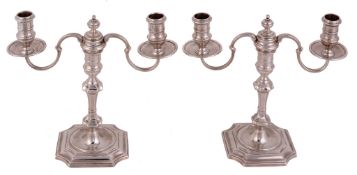 A pair of cast silver twin branch candelabra, maker's mark JCL , London 1967  A pair of cast