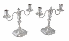 A pair of cast silver twin branch candelabra, maker's mark JCL , London 1969  A pair of cast