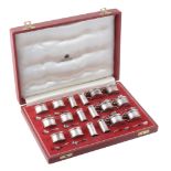 A silver eighteen piece individual cruet set by Asprey & Co  A silver eighteen piece individual