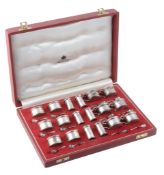 A silver eighteen piece individual cruet set by Asprey & Co  A silver eighteen piece individual