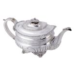 A late George III silver oblong baluster tea pot by Richard Pearce, London 1817  A late George III