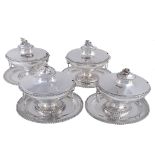 A set of four George III silver sauce tureens and covers by William Holmes &...  A set of four