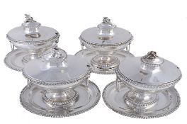 A set of four George III silver sauce tureens and covers by William Holmes &...  A set of four