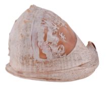 An Italian conch shell carved with a shaped oval figural cameo  An Italian conch shell carved with a