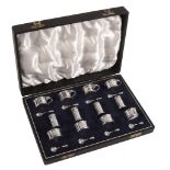 A silver twelve piece individual cruet set by Asprey & Co  A silver twelve piece individual cruet