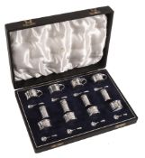 A silver twelve piece individual cruet set by Asprey & Co  A silver twelve piece individual cruet