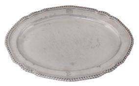 A George III silver shaped oval meat plate by John Wakelin & William Taylor  A George III silver