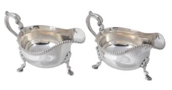 A pair of silver oval sauce boats by Thomas Bradbury & Sons Ltd, Sheffield 1925  A pair of silver