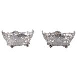 A pair of late Victorian silver oval baskets by Charles Stuart Harris  A pair of late Victorian