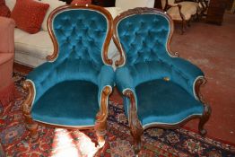A Victorian carved mahogany 'grandmother' and 'grandfather' armchairs