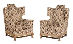 A pair of 17th century style walnut wing back armchairs