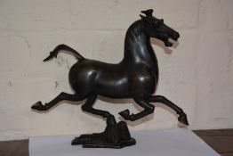 A 20th century Chinese bronze study of a horse, signed, 23cm high, 26.5cm long