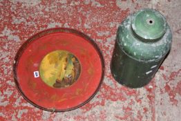 A painted black rectangular metal tray, a red painted circular metal tray and a green painted tea