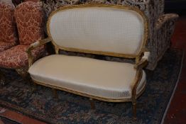 A Louis XVI style giltwood sofa
