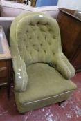 A Victorian Howard style button back armchair - one rear leg stamped 'P' and a Victorian button back