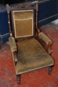 A late 19th century carved wood chair with velvet upholstery. Best Bid