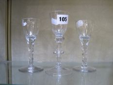 Two 18th Century drinking glasses with faceted stems (one AF) and a baluster shaped drinking glass