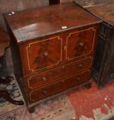 A grained mahogany commode of 19th Century origin with later paint finish. Best Bid