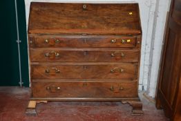 A George III mahogany bureau with four long graduated drawers