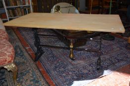A pine kitchen table on a cast iron base 150cm length