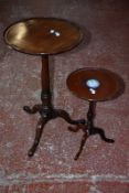 A George III mahogany tripod table, gun barrel stem, pad feet; and another round table