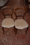 A pair of Victorian hoop back dining chairs.