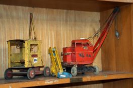 A Sutcliffe toy crane, Tri-Ang crane and a Dinky Elevator Loader.