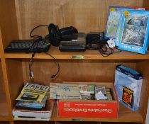 A Spectrum Games Console, a Cheeta joystick and a selection of cassette computer games.(as found)