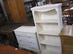 A white painted bookcase and chest of two short and two long drawers. Best Bid