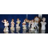 A small collection of decorative pottery and porcelain to include five cherubs figures (7). Best