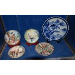 An Oriental blue and white charger, 37cm in diameter, three 20th Century Oriental plates c.1986