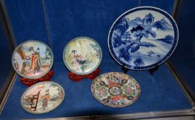 An Oriental blue and white charger, 37cm in diameter, three 20th Century Oriental plates c.1986