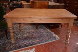 A Victorian style pine kitchen table, turned legs 150cm length
