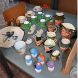A quantity of decorative items to include crested ware, Beswick, character jugs, Wade figures, Royal