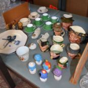 A quantity of decorative items to include crested ware, Beswick, character jugs, Wade figures, Royal