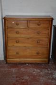 A Victorian walnut chest of drawers.