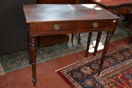 A19th Century mahogany side table with two drawers on ring turned supports.