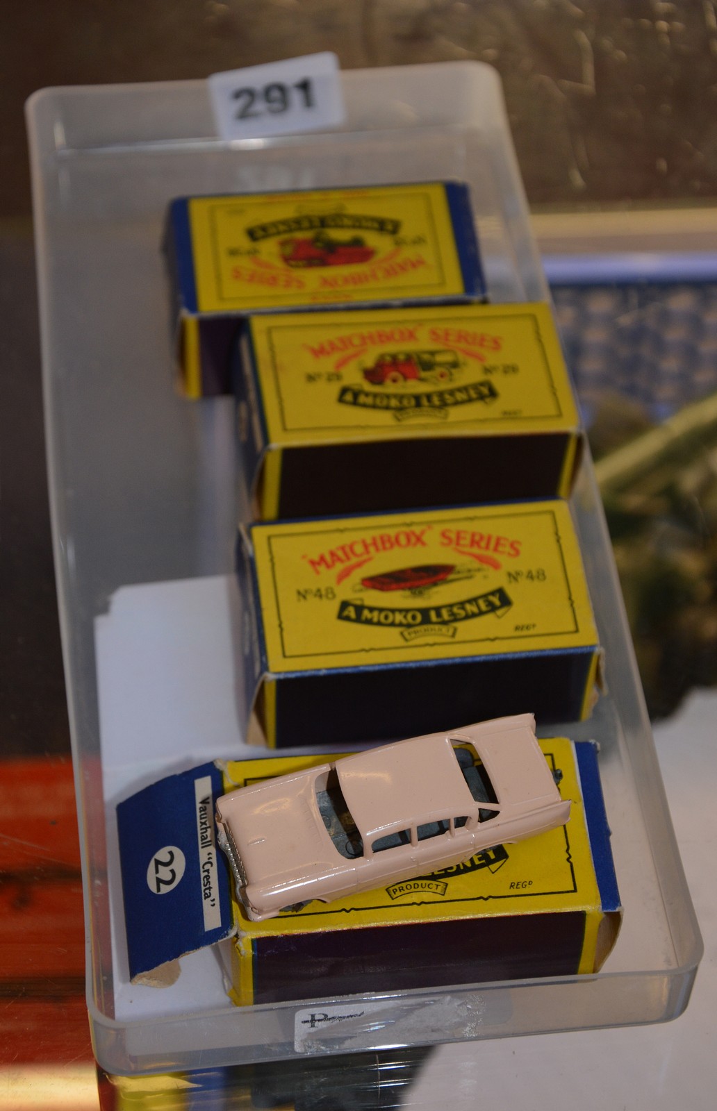Four Moko Lesney Matchbox series diecast cars in boxes. No. 29 Milk Van, No. 38 Refuse Collector,