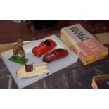 Two Schuco Akustico 2002 clockwork sports cars, cream and red, played with, a red Schuco Kommando