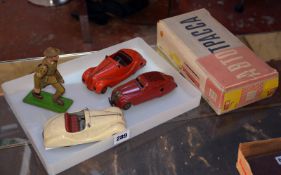 Two Schuco Akustico 2002 clockwork sports cars, cream and red, played with, a red Schuco Kommando