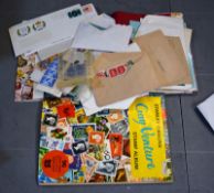 Stamps: A Triumph Stamp Album and a W H Smith Global Album and a quantity of loose stamps.. Best