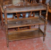 A late Victorian mahogany whatnot with turned supports on castors 100cm wide