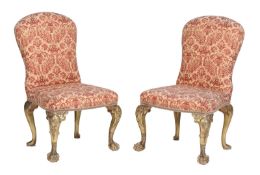A pair of George II style gilt and upholstered side chairs on cabriole legs with shell carved legs